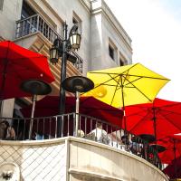 Red and yellow umbrellas outside of a restaurant
