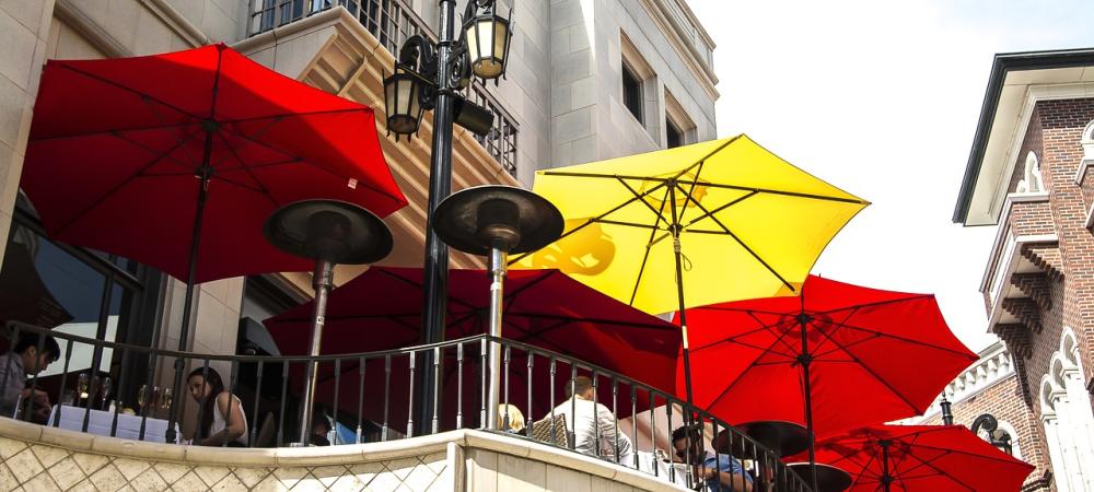 Red and yellow umbrellas outside of a restaurant