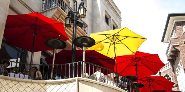 Red and yellow umbrellas outside of a restaurant